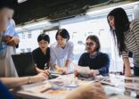 Women working together in modern working space