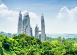 Cityscape in Singapore. Amazing skyscrapers among green trees