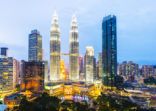 The Kuala Lumpur City Skyline With the Petronas Towers Illuminated at Sunset, Malaysia.