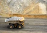 Yellow large dump truck in Utah copper mine seen from above