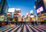 Pedestrians crossing the street at Shibuya crossing with motion blur