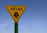 yields sign with downward pointing arrow